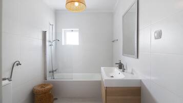 Bathtub, hair dryer, towels