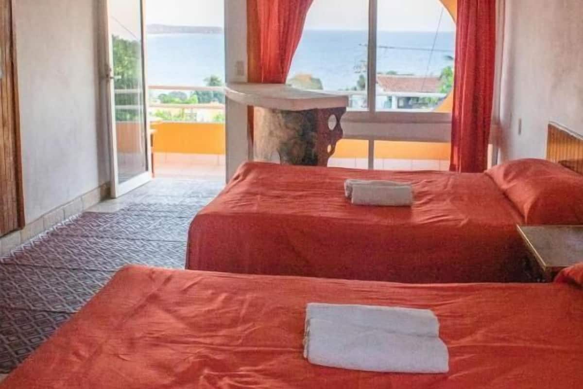 Habitación superior, vista al océano | Ropa de cama