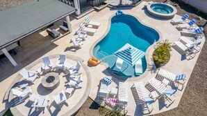 A pool area with multiple lounge chairs, a hot tub, and a barbecue area. -  Large Groups Welcome! Newly Added Pickleball Court!
 (Scottsdale)