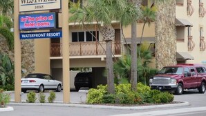 A hotel named Westwinds with a sign indicating it offers hotel rooms for the price of a resort. - Westwinds Waterfront Luxury Condo Beach and Pool (Treasure Island)
