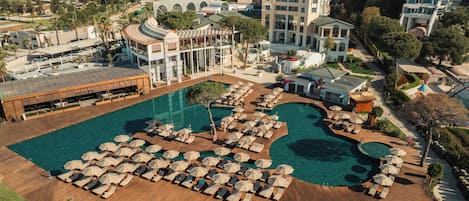 Indoor pool, outdoor pool, open 9:00 AM to 8:00 PM, pool umbrellas