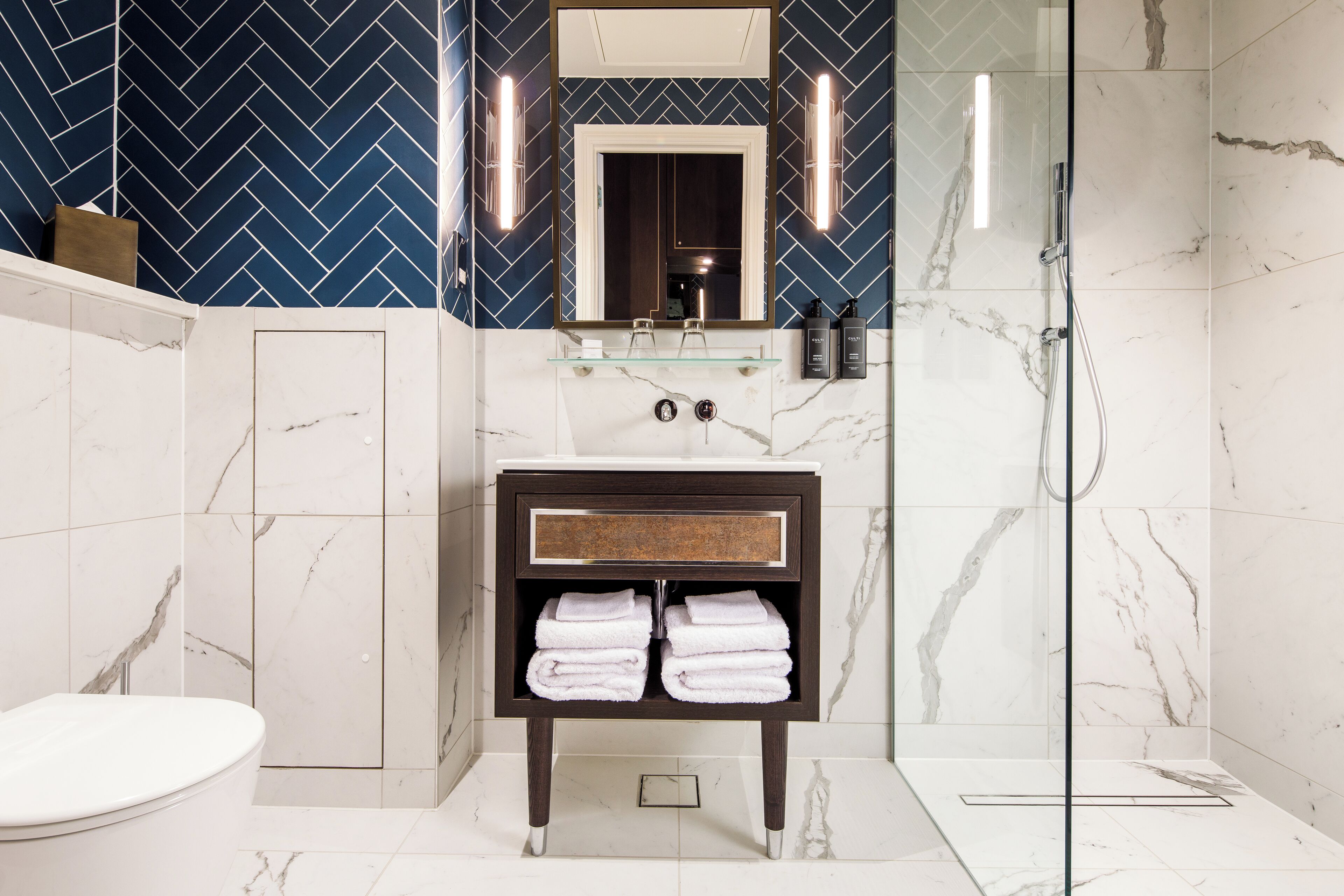 Suite, 1 King Bed | Bathroom | Shower, free toiletries, hair dryer, bathrobes