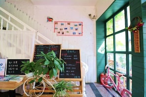 Unclassified image, 5 of 96, button - Xiyu Hostel · Cat Café (Yangshuo)