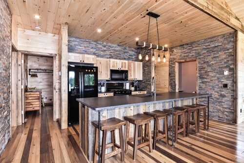 NEW BUILD! Lakefront resort cabin with fireplace, sandy beach, dock, fire pit!