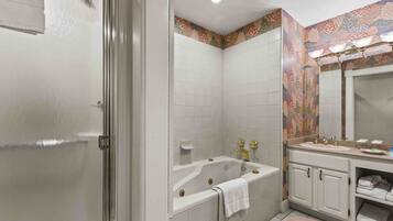 Bathtub, jetted bath, hair dryer, towels