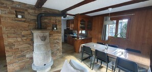 Enjoy meals in the kitchen with oven and dining area with a table and chairs.