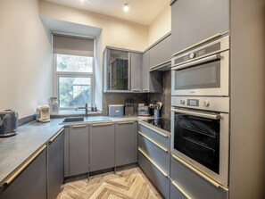 Dishwasher, highchair - A super-stylish modern holiday home that sleeps up to six. (Barmouth)