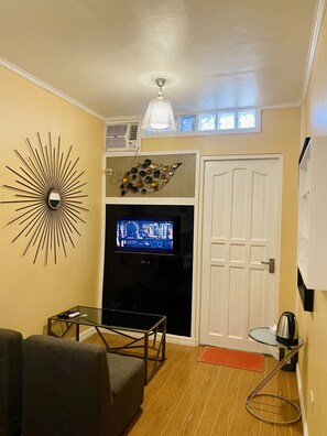 Standard Double Room | Living area | 24-inch flat-screen TV with digital channels, TV - Little Norway guest house (Lapu-Lapu)