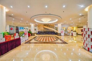 A spacious lobby with a central staircase, a chandelier, and a checkered floor pattern. - Yangfang Dadu Hotel (Beijing)