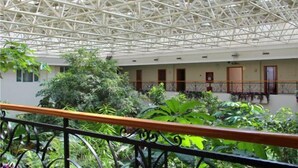 A spacious atrium with a high ceiling featuring a geometric metal framework. - Yangfang Dadu Hotel (Beijing)