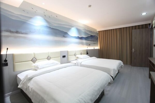 A hotel room with two beds, a large wall mural, and a wooden wardrobe. - Longshangong Hotel (Taihu County)