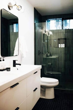 Shower, hair dryer, towels, soap
