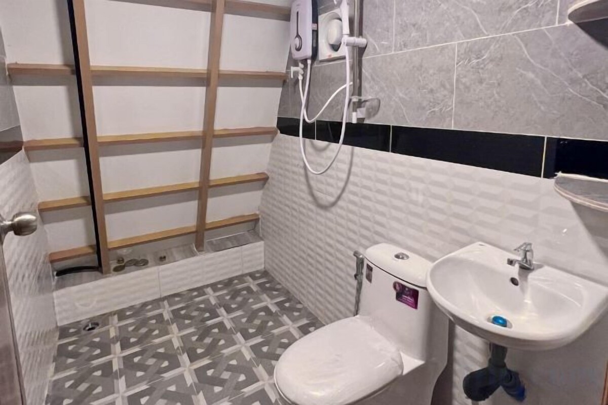 Shower, hair dryer, slippers, towels