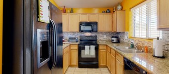 Desert oasis with an enclosed yard, firepit, washer/dryer, and central AC