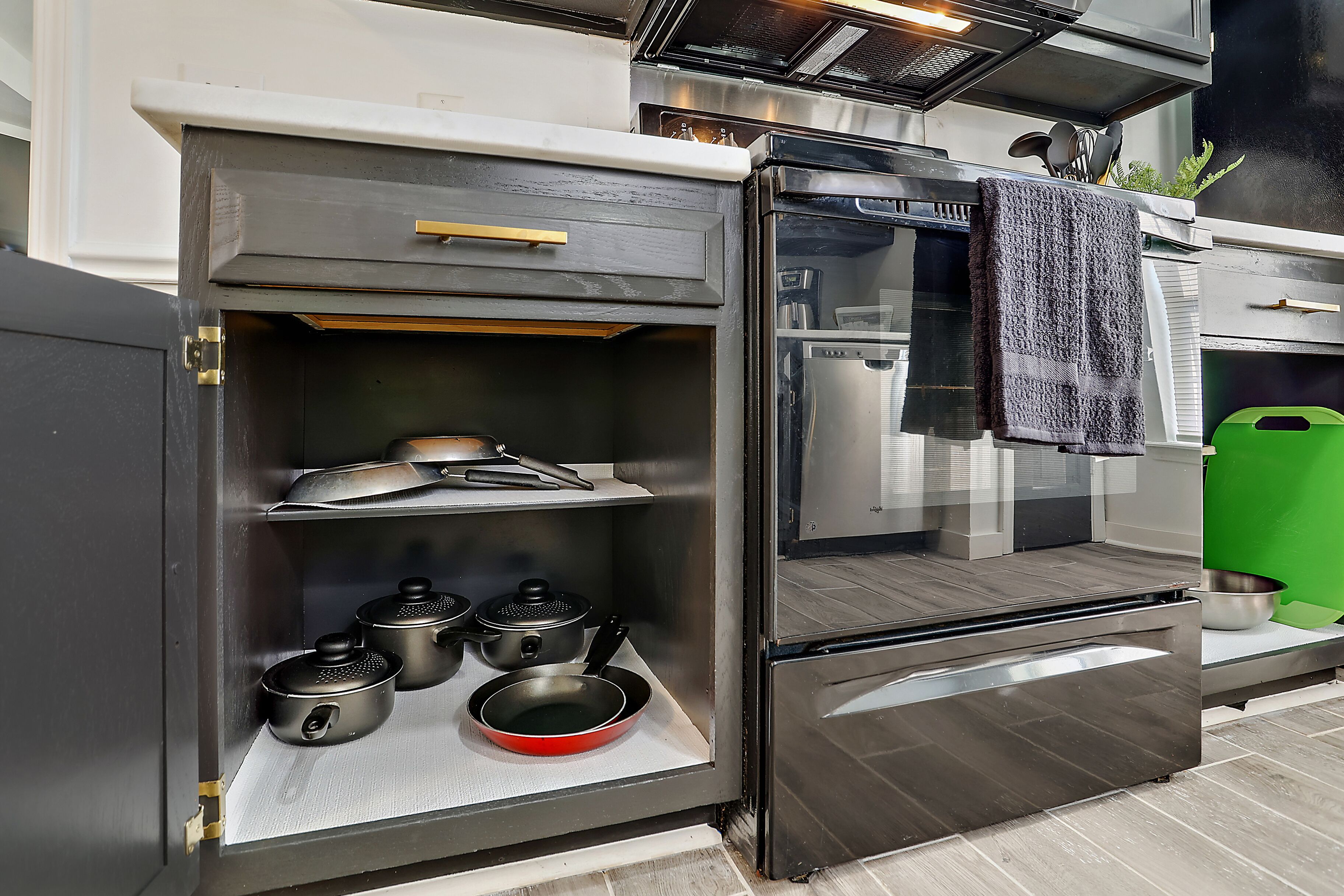 A compact kitchen with a built-in oven, a microwave, and a small countertop.