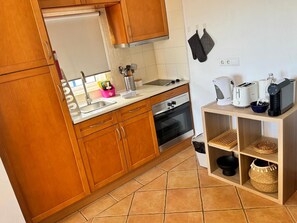 Fridge, microwave, stovetop, coffee/tea maker