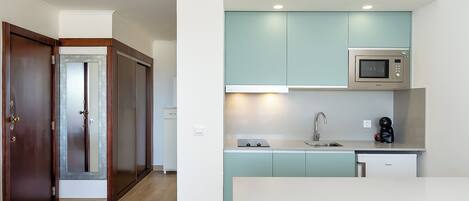 Fridge, microwave, stovetop, coffee/tea maker