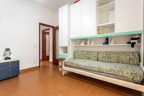 A room with a sofa, a cabinet, a dresser, and a door. - Holiday Home "Casa Splendida" with Mountain View, Terraces & Wi-Fi (Monreale)