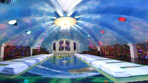 A room with a unique ceiling design, a central light fixture, and a mirrored floor. - MEDDOM Park (Thung Nai)