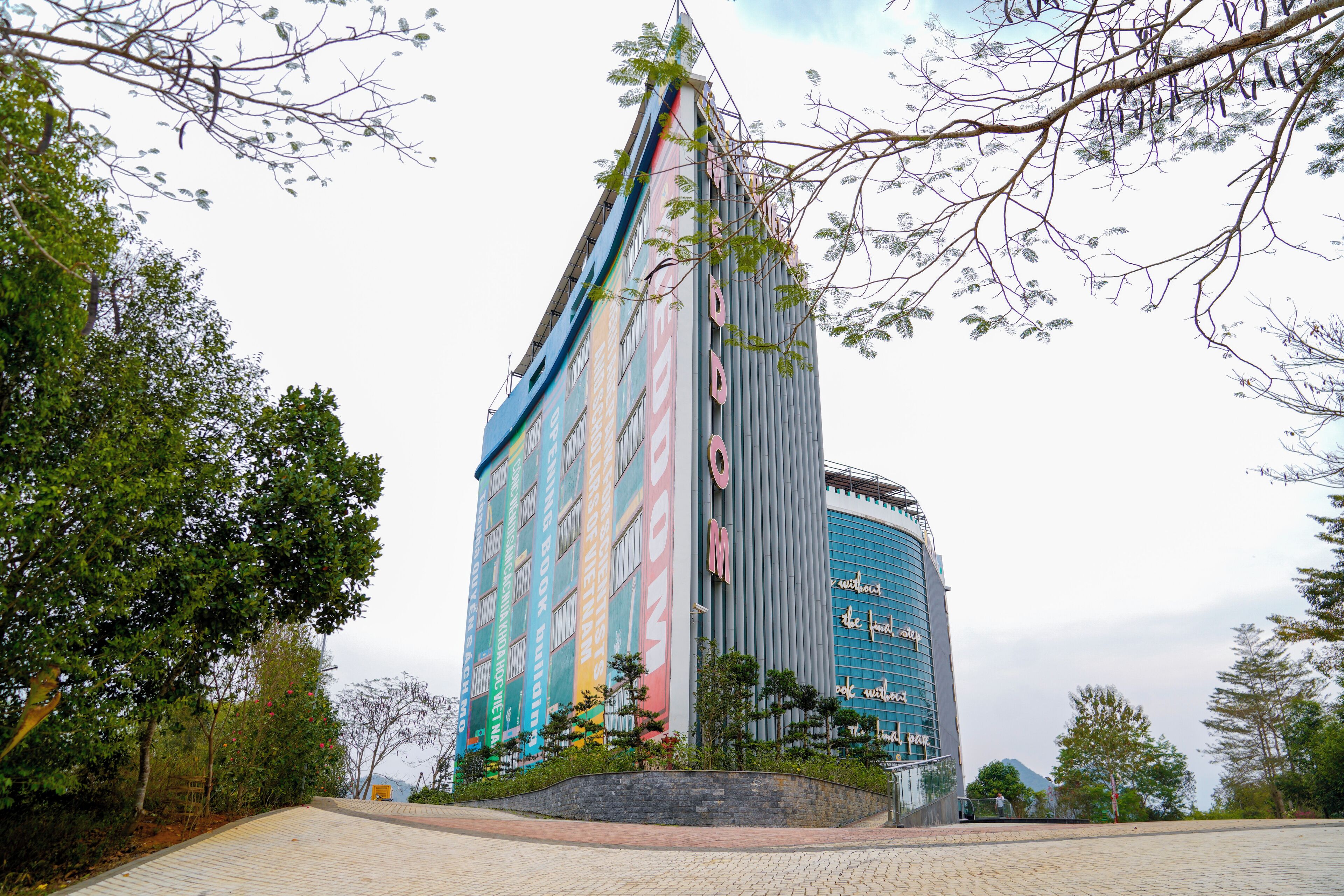 A modern building with a curved facade and large windows.