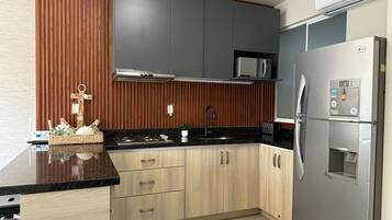 Fridge, microwave, stovetop, coffee/tea maker