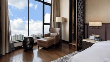 Presidential Studio Suite | Living area | 42-inch LCD TV with cable channels, TV