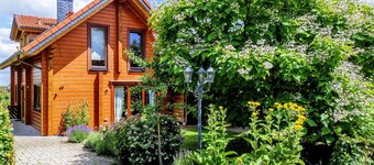 Cozy log cabin by the forest with large garden