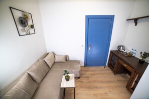 Suite Sénior, 1 grand lit | Coin séjour