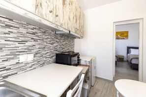 Basic Twin Room | Private kitchen | Stovetop, cookware/dishes/utensils, kitchen islands - Villa Ostrich (Santorini)
