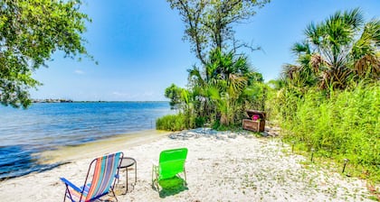 Waterfront condo featuring a lovely patio with views, AC, & pool access