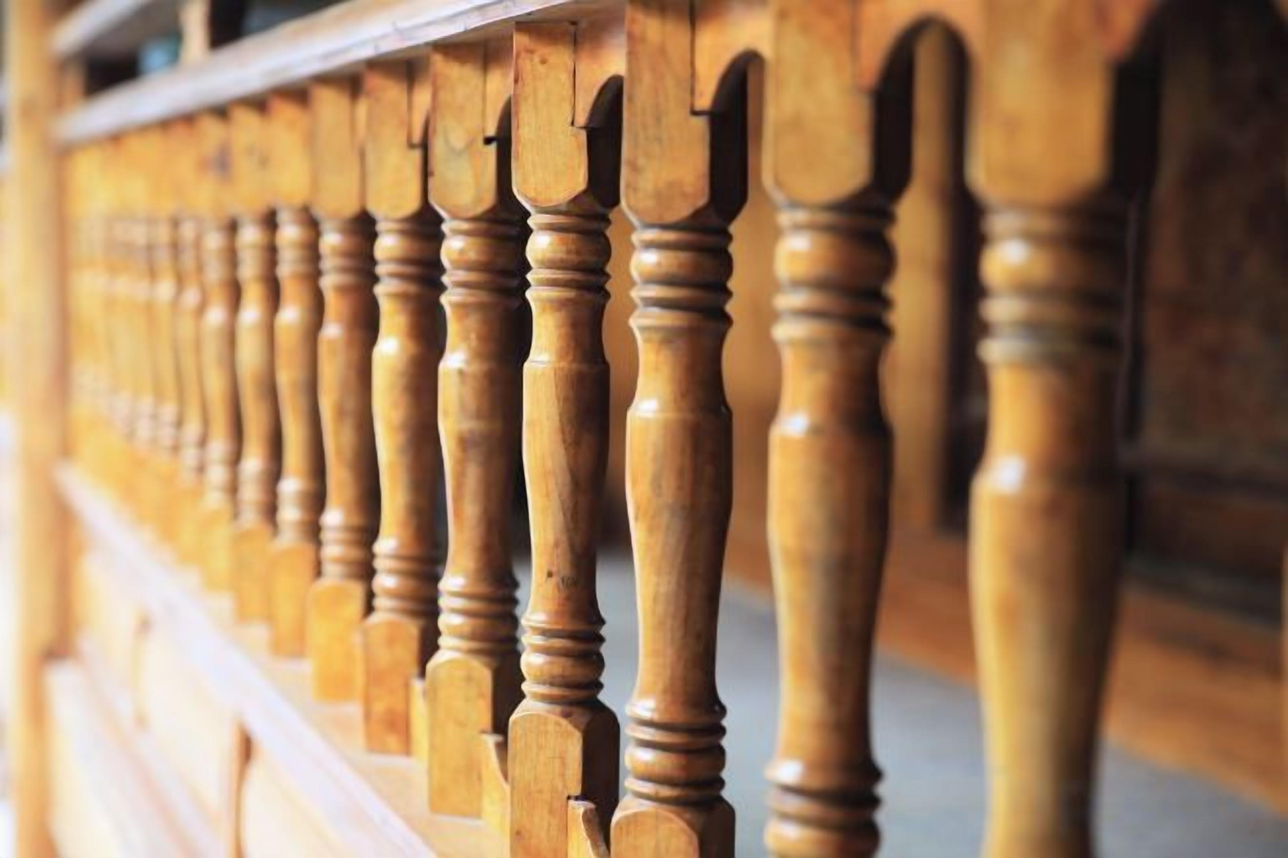 A wooden balustrade with turned balusters.