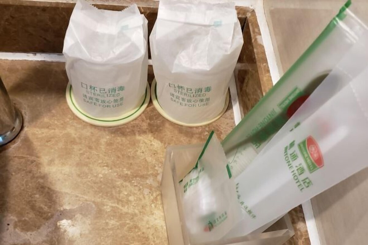 Two white bags labeled 'STERILIZED' and a plastic container with green text.