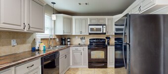 Dreamy duplex with dog-friendly fenced yard, private outdoor living, AC, & W/D