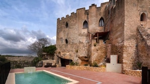 A stone building with a swimming pool and a patio area. - Mas d´en Tarres by Interhome (El Catllar)