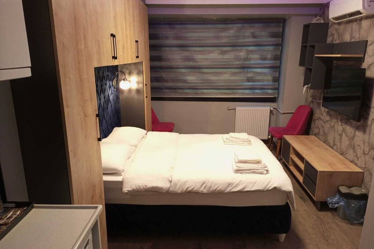 Premium bedding, blackout curtains, soundproofing, iron/ironing board
