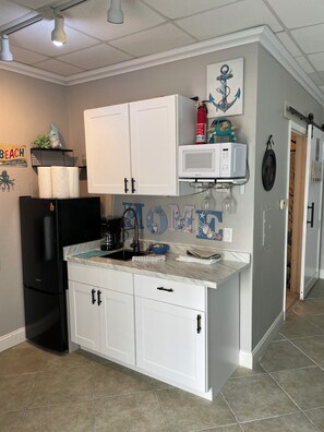 Fridge, microwave, coffee/tea maker, toaster