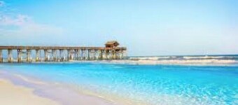 Resort with outdoor pool and lazy river only steps from the beach!