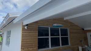 A building with a wooden exterior and a sign that reads "A handsome fishery with his best catch."