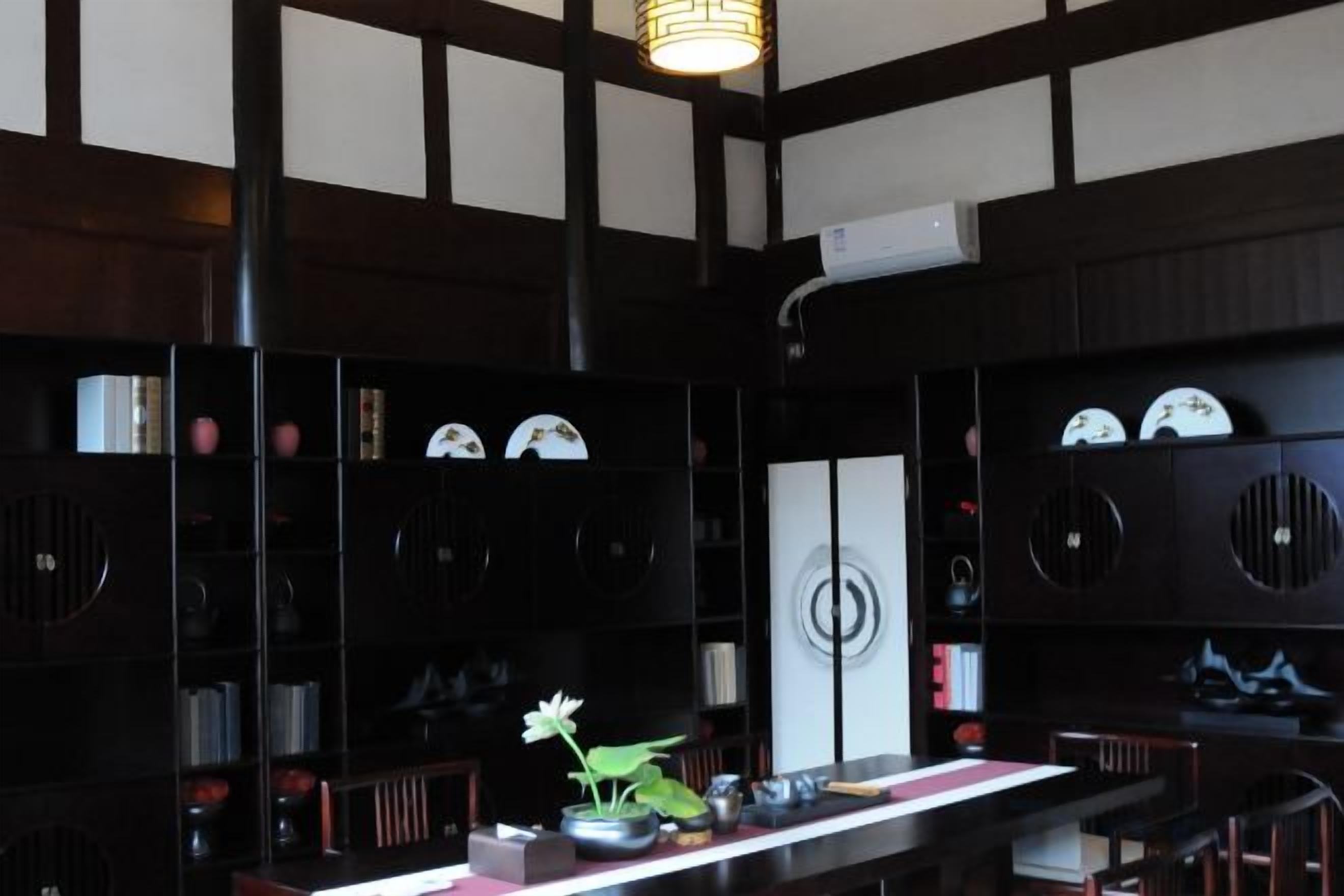 A traditional Japanese-style room with tatami flooring, a low table, and a shoji screen.