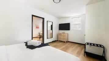 1 bedroom, desk, iron/ironing board, travel crib