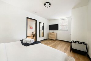1 bedroom, desk, iron/ironing board, travel crib
