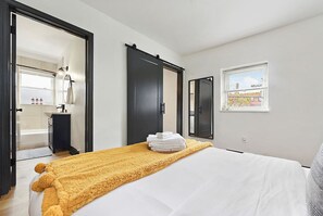 1 bedroom, desk, iron/ironing board, travel crib