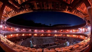 A large, circular theater with tiered seating and a central stage. - Yuqinglou Inn (Longyan)