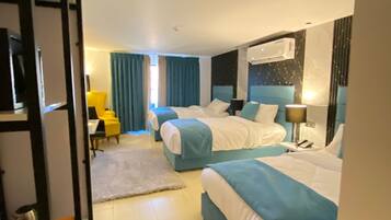 Triple Room | Free minibar items, in-room safe, laptop workspace, blackout drapes