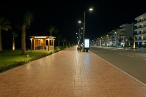 Stroll along the walkway lined with palm trees and enjoy dining options at the nearby Bar & Restaurant.