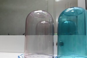 Two transparent glass containers on a white surface. - Ningguo Julongwan Farmstay (Ningguo)