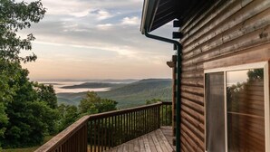 A wooden deck with a view of a lake and hills. - Compton Mountain Cabin w/ Big Mountain Views (Ponca)