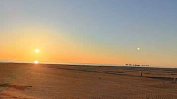 Beach nearby, white sand, sun loungers, beach umbrellas