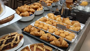 A breakfast buffet with various pastries, including croissants and pies, arranged on trays. - Hotel Ricci (Rimini)