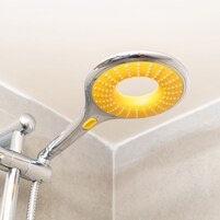 A showerhead with a yellow circular head and a chrome handle.